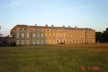 Petworth House, Sussex, one of the many country houses which hosted a production in aid of charity (July 2003).  Part of the audience is visible refreshing itself before the performance.